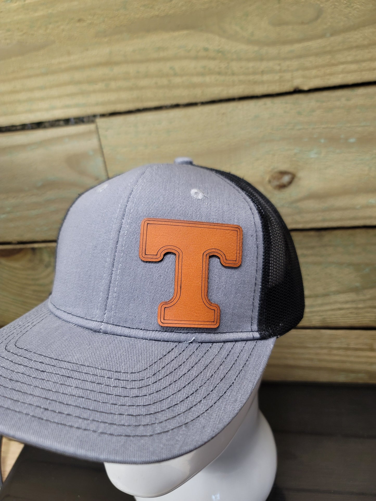 Orange T, Custom Leatherette Patch on a structured Port Authority Grey/Black snap back cap